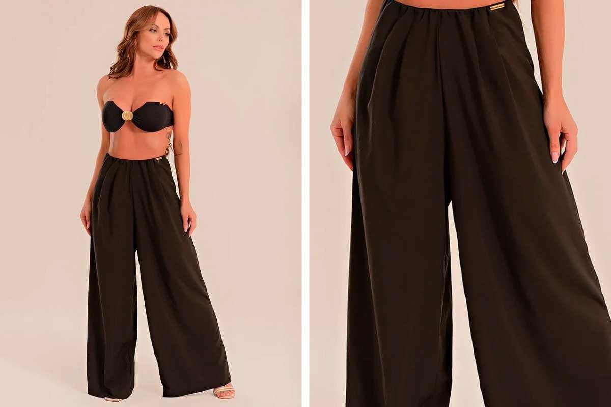 mulher usando calca como saida de praia